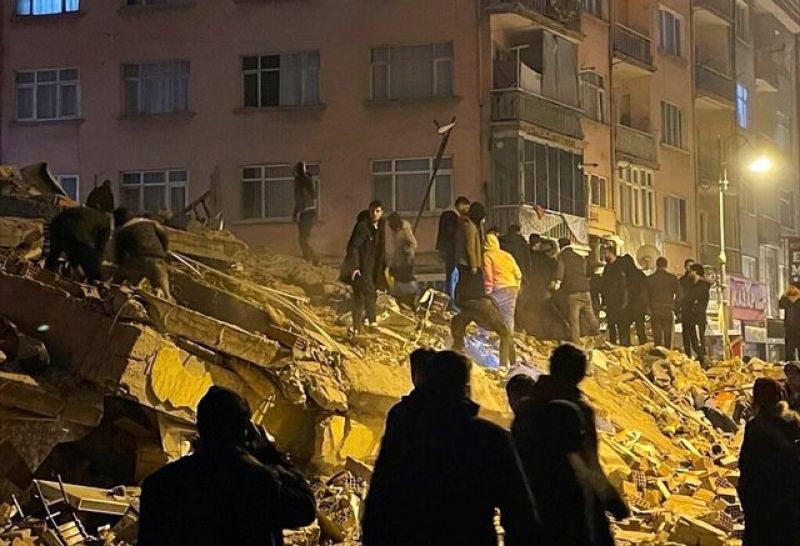 people-try-to-reach-trapped-residents-in-a-collapsed-building-in-pazarcik-in-kahramanmaras-province-southern-turkey-early-monday-feb-42c88df1ded7c0d211160dcc02d77ceb1675661094.jpg