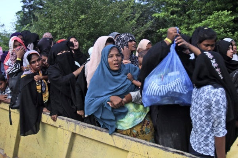 ethnic-rohingya-women-and-children-board-a-truck-as-they-are-being-relocated-from-their-temporary-shelter-in-banda-aceh-in-indonesia-on-27-dec-2023-68bf2cb635350683a86128c7b43a88cd1705430969.jpg