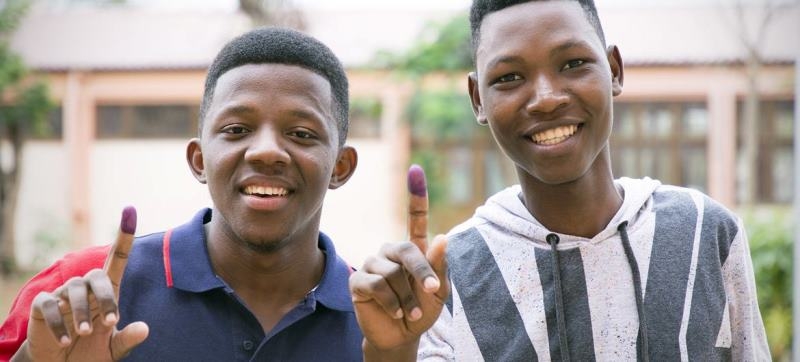 two-young-men-display-the-ink-marks-on-their-fingers-indicating-they-have-cast-their-votes-in-an-election-a95614eb32e7fab5f0d4a7b2e6d993c31726421993.jpg
