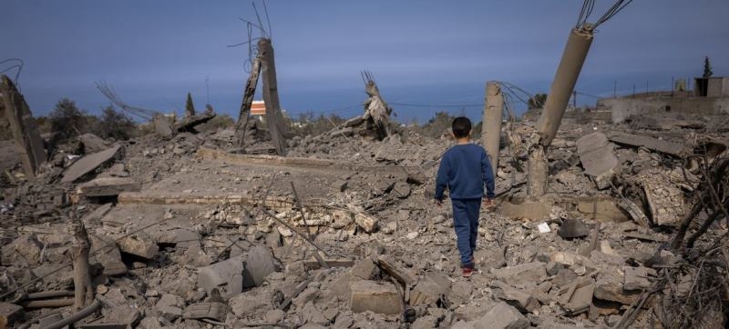 a-5-year-old-boy-walks-through-destroyed-buildings-in-majdal-zoun-southern-lebanon-8eac36b8d68df4d7a07b6bdcbb9d11931727198791.jpg