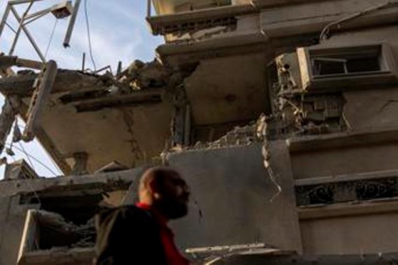 a-man-looks-at-damaged-building-after-projectiles-fired-from-lebanon-hit-a-home-in-tira-central-israel-saturday-nov-1860c42c75dd76bed92bda5e2938f5521730607256.jpg