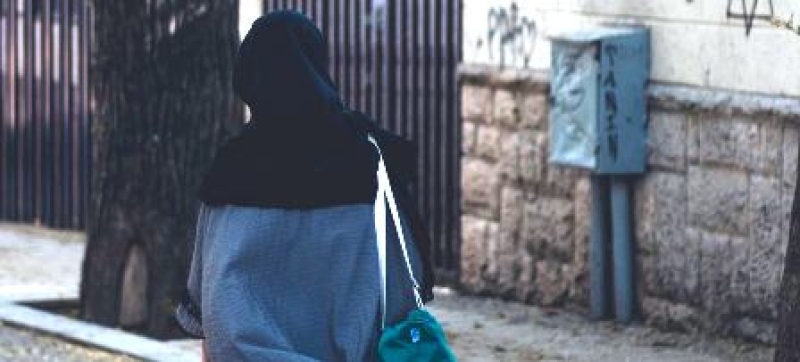 a-woman-in-a-hijab-walks-through-the-streets-of-tehran-the-iranian-capital-80f39cb49e6d71aebb941e1df6032fef1734158694.jpg