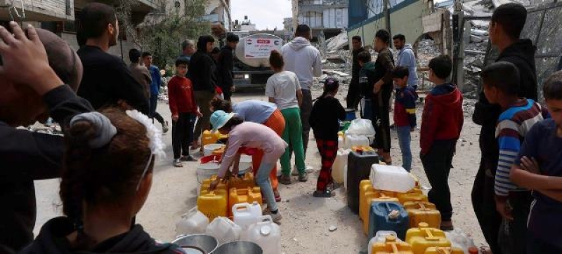 gaza-residents-lining-up-near-the-water-truck-to-fill-their-jugs-a83965160a0f4687e6ae012573f2bae21744735212.jpg