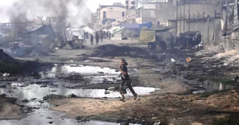 a-palestinian-girl-runs-past-the-ruins-of-destroyed-buildings-along-the-gaza-city-shoreline-on-monday-june-9-2025-7aa54301bf4005d26e0bc650465874411749529783.jpg