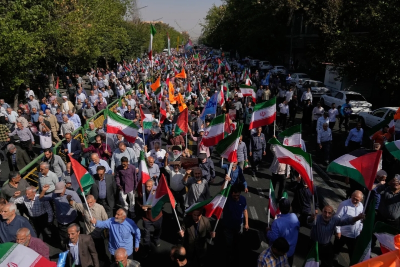 iranians-hold-national-and-palestinian-flags-during-an-anti-israeli-rally-after-their-friday-prayers-at-the-enqelab-e-eslami-islamic-revolution-street-in-tehran-iran-friday-oct-d4fafc24621a8990c52be827519c98551760239378.jpg