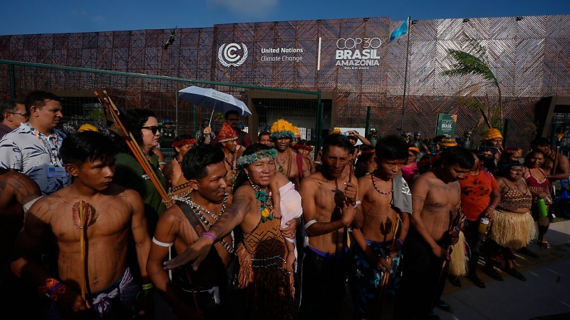 an-indigenous-group-blocks-an-entrance-to-the-cop30-u-40af45223085c80662a27141d0fb93d31763229089.jpg