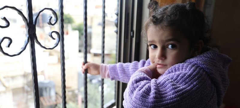 a-girl-looks-out-the-window-of-her-home-in-the-jenin-refugee-camp-in-the-west-bank-where-she-and-other-family-members-were-trapped-during-an-israeli-military-operation-54deab5161a31f6afd3e0605522ed4c21787234938.jpg