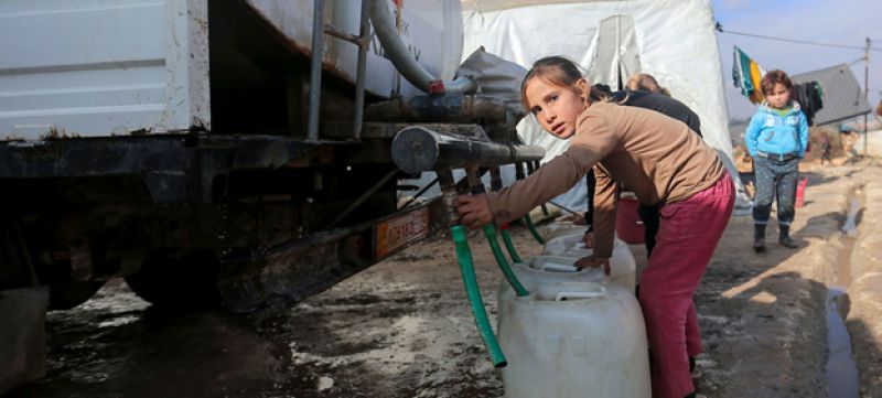 a-young-girl-collects-water-from-a-tanker-truck-in-an-idp-camp-in-northwest-syria-8139f0912a11fd2a0b026577af2087b81627538914.jpg