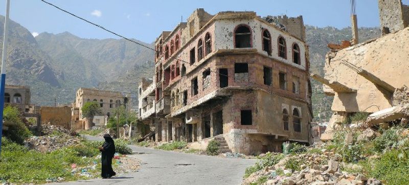 a-woman-walks-in-taiz-a-war-ravaged-city-in-yemen-split-by-a-frontline-9aa6f969cdcb3051d0841791689793e31631171576.jpg