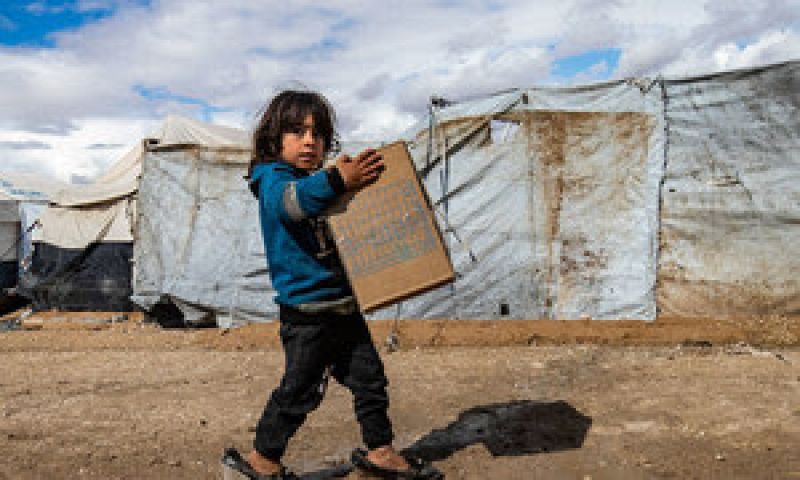syria-a-child-carries-winter-clothing-kits-distributed-by-unicef-in-al-hol-camp-in-northeastern-syria-67ae005799177bfed3103fb8b9dd10651632898526.jpg