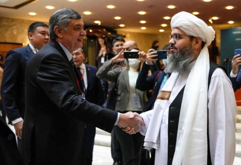 russian-presidential-envoy-to-afghanistan-zamir-kabulov-l-shakes-hands-with-a-member-of-the-taliban-delegation-prior-to-an-intl-confce-on-afghanistan-on-wednesday-c9fb4a3183adc45378f33df1927e97c81634749451.jpg
