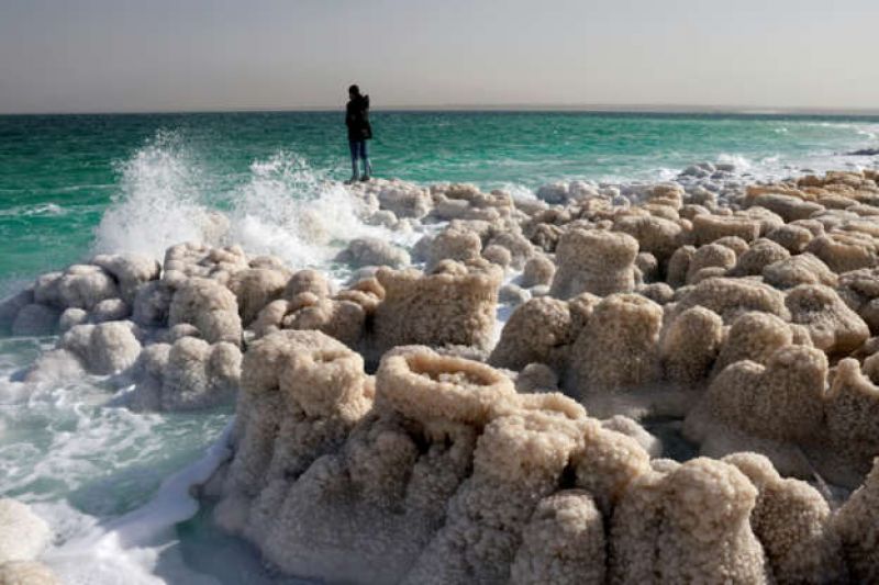 dead-sea-a-hiker-stands-atop-crystalised-minerals-in-the-israeli-kibbutz-ein-gedi-area-on-the-shores-of-the-dead-sea-ad1f68f8b33584811c4c5b3155f8b51d1635314018.jpg
