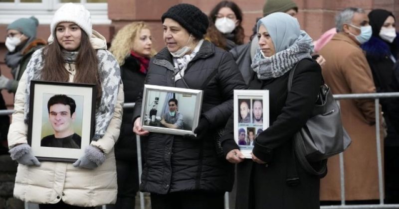syrian-women-samaa-mahmoud-mariam-alhallak-and-yasmen-almashan-hold-pictures-of-relatives-who-died-in-syria-before-the-verdict-in-front-of-the-court-in-koblenz-germany-thursday-jan-18555a2b618c0bd8428e0270301bab5a1642093116.jpg