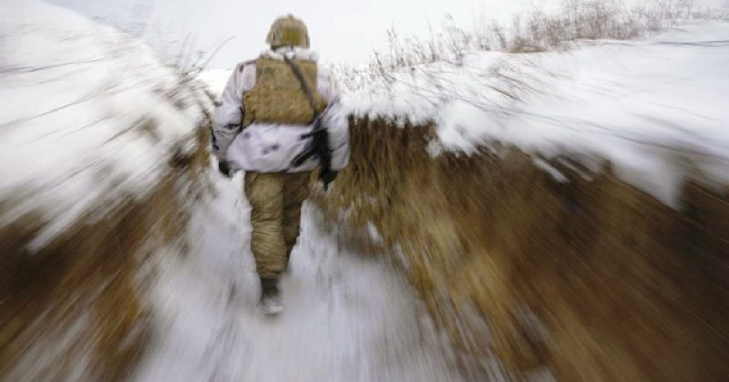 ukrainian-serviceman-walks-through-a-trench-on-the-front-line-in-the-luhansk-area-eastern-ukraine-thursday-jan-c2bea813c1af15fad814940e7cb7d3691643349495.jpg