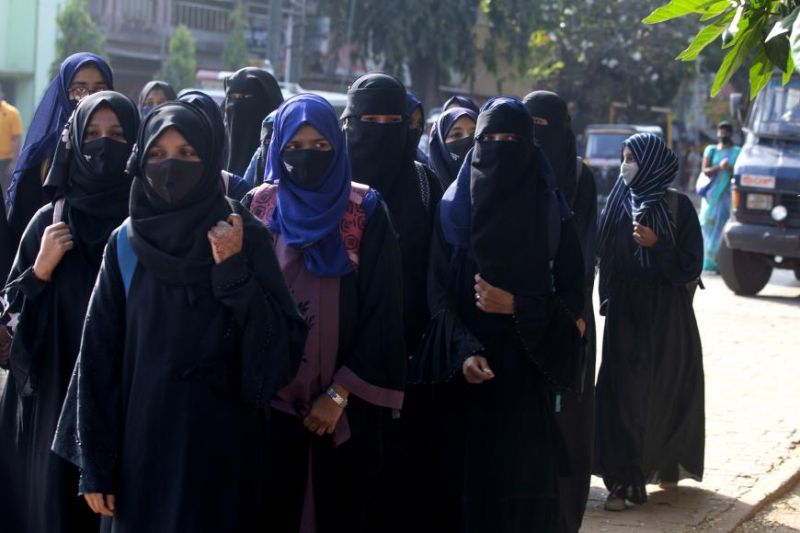 human-rights-female-muslim-students-barred-from-entering-their-classrooms-for-wearing-a-hijab-walk-outside-their-college-in-udupi-karnataka-india-february-7-2022-46548166a895710d55de178fc0eb75391645164468.jpg