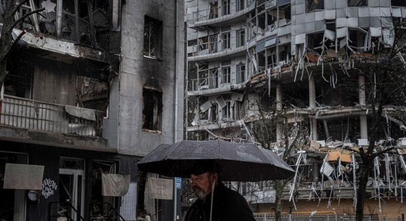 a-man-walks-past-destroyed-apartment-buildings-in-kharkiv-ukraine-a2b53b45ff75dd83d357230fa955e6451652425582.jpg