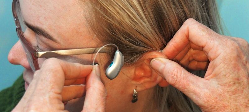 a-woman-being-fitted-for-a-receiver-in-canal-ric-hearing-aid-a6361b1e30675c78059c151a688231001652709303.jpg