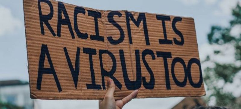 racism-is-a-virus-sign-at-a-black-lives-matter-protest-in-montreal-canada-719a73d2687c2b51c8e9d3f890f031fd1657035802.jpg