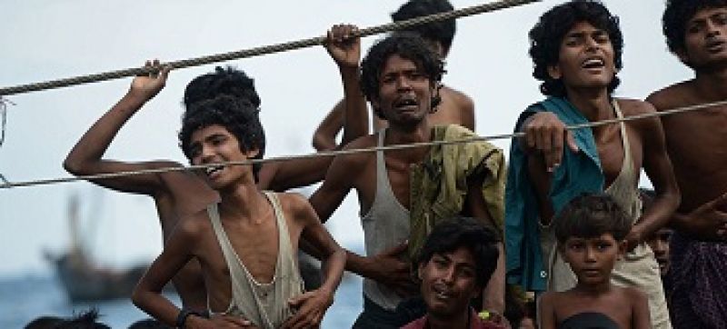 stranded-rohingya-boat-people-desperate-for-food-and-water-sit-on-the-deck-of-an-abandoned-smugglers-boat-drifting-in-thai-waters-off-the-southern-island-of-koh-lipe-in-the-andaman-sea-1a2dca1692ae4992d0e21f68599c78bb1660152259.jpg