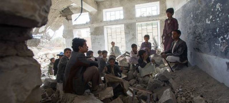 children-sit-in-a-former-classroom-in-a-destroyed-school-in-saada-city-yemen-3c0c496faca9d6b3b74b8b16e63be89d1663051519.jpg