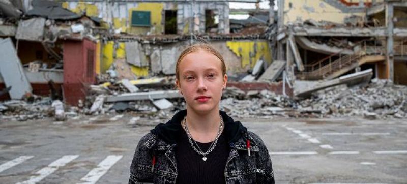 a-twelve-year-old-girl-stands-in-front-of-her-school-which-was-destroyed-in-an-air-strike-during-the-conflict-in-kharkiv-ukraine-f200545f964b2be120d41875c2ffd8a41663907353.jpg