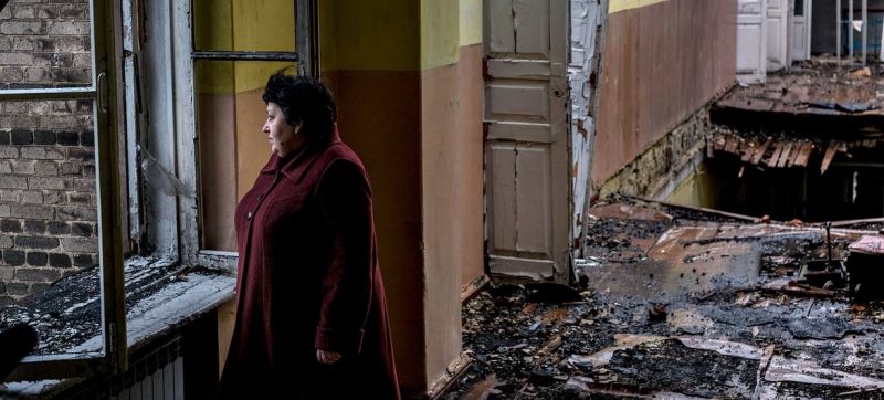 a-woman-stands-in-an-abandoned-school-damaged-after-a-shell-strike-in-krasnohorivka-donetsk-oblast-ukraine-54186e19a6cba4bcaffddf135021d8661664377227.jpg