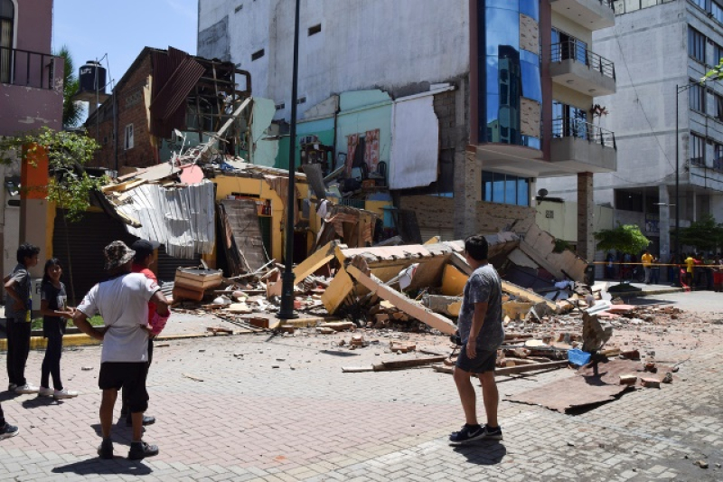 residents-look-at-a-building-that-collapsed-after-an-earthquake-shook-machala-ecuador-saturday-march-18-2023-8cbfadf2df481000367cf3fd288fd3c81679205116.jpg