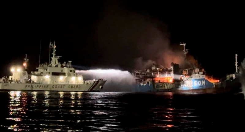 philippine-coast-guard-ship-trains-its-hose-as-it-tries-to-extinguish-fire-on-the-mv-lady-mary-joy-at-basilan-southern-philippines-early-thursday-march-30-2023-3afe12662813fd024776525b25fbc4cb1680156776.jpg