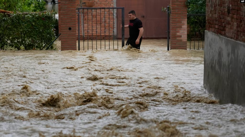 a-man-walks-in-a-flooded-street-in-the-village-of-castel-bolognese-italy-may-17-2023-1a8e95a07572c8492c91fa2ab703da501684648350.png