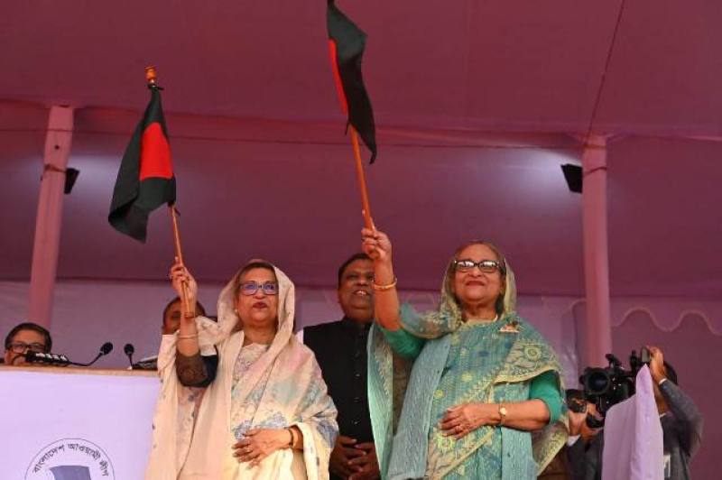 pm-sheikh-hasina-and-her-sister-sheikh-rehana-waving-the-national-flag-at-a-rally-in-sylhet-on-wednesday-20-dec-2023-e7a90e80b9e3a6e1fca2115d33879f9d1703088875.jpg