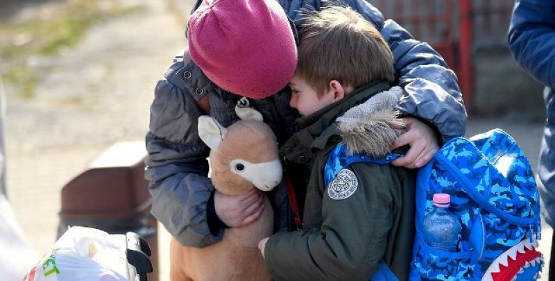 a-ukrainian-girl-comforts-her-six-year-old-brother-as-they-prepare-to-leave-a-unicef-supported-centre-in-romania-for-their-next-destination-63fc5f692be9d7822e32944e62abe72b1713976092.jpg