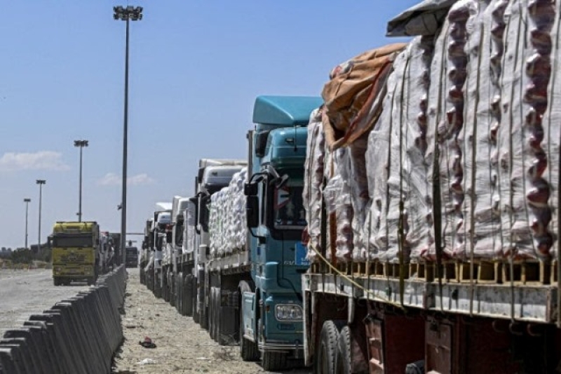 egyptian-trucks-carrying-humanitarian-aid-bound-for-the-gaza-strip-queue-outside-the-rafah-border-crossing-on-the-egyptian-side-on-march-23-2024-0562e4a66d51502af1566e9ae691883c1715183046.jpg