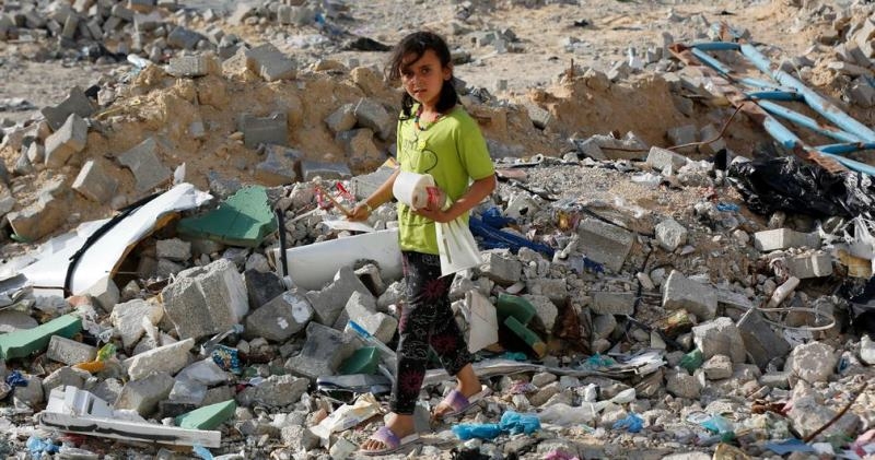 a-child-walks-through-the-rubble-in-rafah-82e4dd7671227a9c61a7bc645153d0f01716571024.jpg