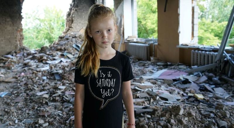 eight-year-old-anya-stands-amidst-rubble-in-her-damaged-school-in-buzova-ukraine-8e92b12b3cc1579df91475a1e3b23ea41717525757.jpg