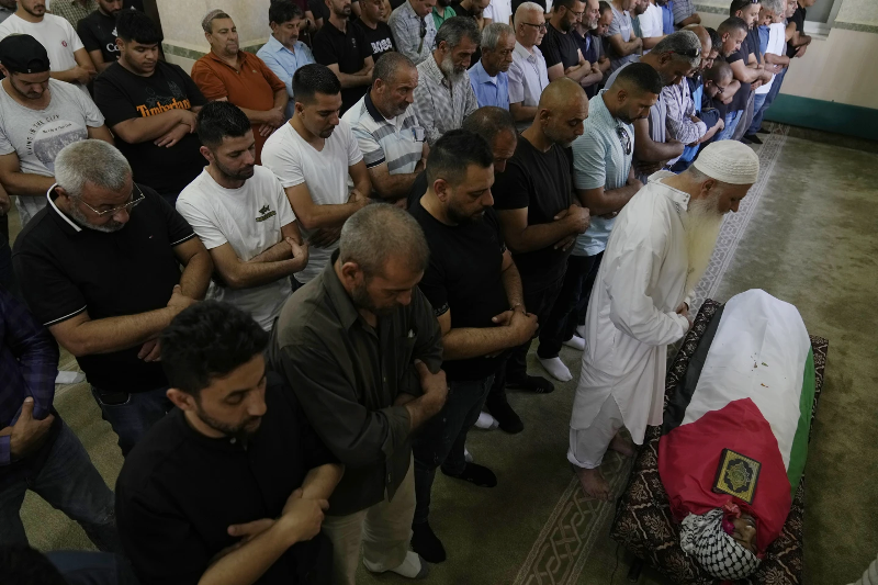 palestinian-mourners-offer-janaza-prayer-for-mohammad-hoshiya-12-during-his-funeral-in-the-west-bank-village-of-qatana-southwest-of-ramallah-saturday-june-22-2024-6cdf7f8df36a8e55d32e80aba6bb2fb91719119357.png