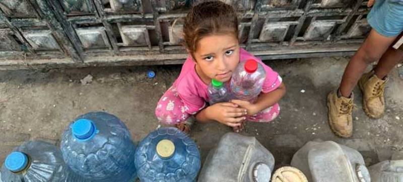 a-child-waits-to-fill-water-containers-in-gaza-57c6c63d4971f8701d085ee873a044f21720031845.jpg