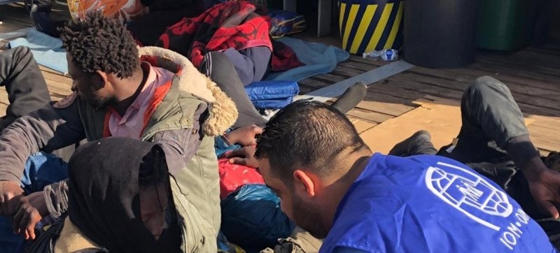 un-migration-agency-iom-aid-workers-offer-help-to-migrants-who-have-been-returned-to-shore-in-libya-after-attempting-to-cross-the-sea-to-europe-85f3adb6d6e8f9f4dca04c6f7f8183ce1720289893.jpg