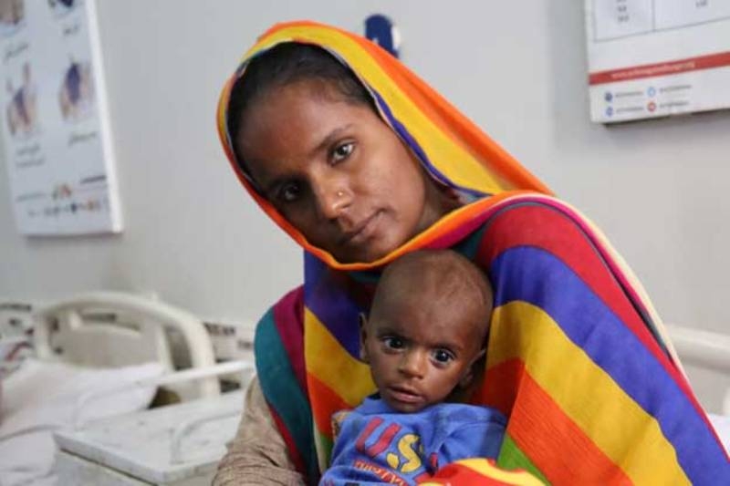 a-mother-and-her-9-month-old-daughter-visit-a-health-center-run-by-action-against-hunger-in-the-tando-muhammad-khan-nsc-district-6dd354713756421c3c969eb1b69c79c31724219092.jpg