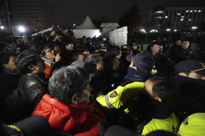 people-try-to-enter-as-police-officers-stand-guard-in-front-of-the-national-assembly-in-seoul-south-korea-tuesday-dec-0058ddbc0589140ba6ac22afd5dea5f11733249884.jpg