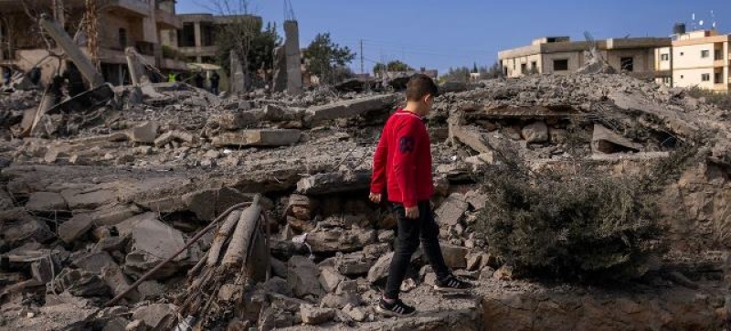 a-young-chiild-walks-amongst-the-ruins-of-houses-in-southern-lebanon-da92bd0ce8c6cc500cbec329a377ae601737999428.jpg