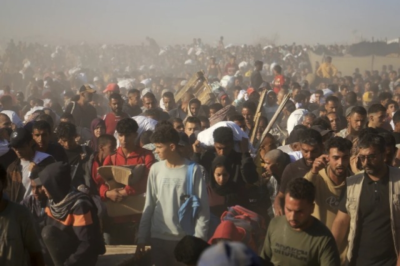 palestinians-carry-boxes-and-bags-containing-food-and-humanitarian-aid-packages-delivered-by-the-gaza-humanitarian-foundation-a-u-99eec6df231e5ba6a7f013fc5f5ea6aa1748580424.jpeg